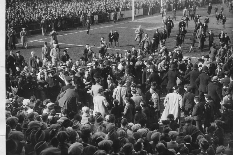 Crown invading the Kenilworth Road pitch after promotion was won in 1937