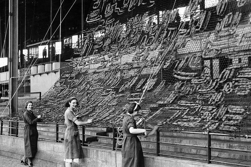 Camoflage netting being put up on the Main Stand in 1940