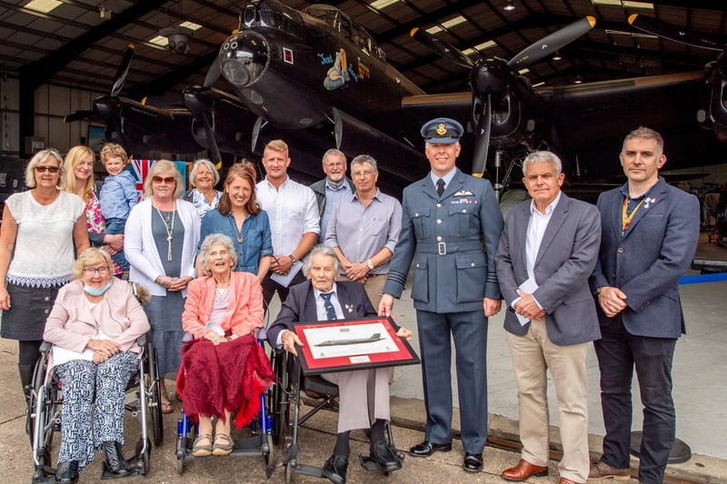 Fred Pearce (centre) with family and friends and Wing Commander Scott Williams at his 100th birthday celebration.