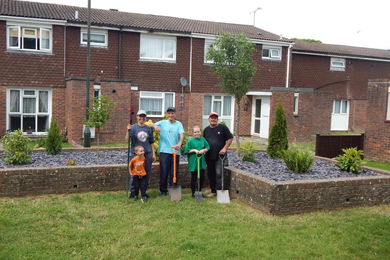 Residents Dave Saunders, Mark Luffman and Isabel Carvalho with some of the completed work in the communal area