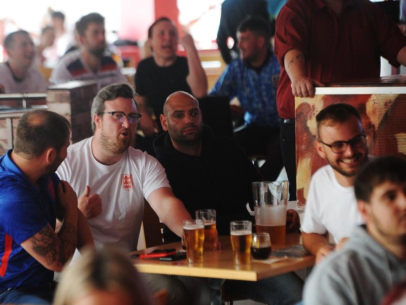 England fans at the Coyotes Bar, New Road, Peterborough EMN-210629-193919009