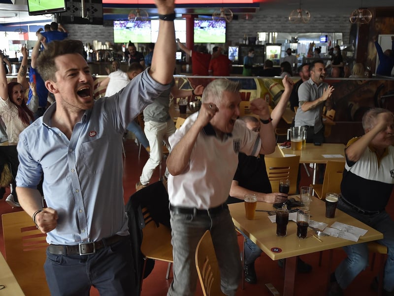 England fans at the Coyotes Bar, New Road, Peterborough EMN-210629-193930009