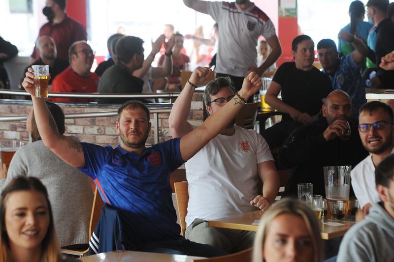 England fans at the Coyotes Bar, New Road, Peterborough EMN-210629-193315009