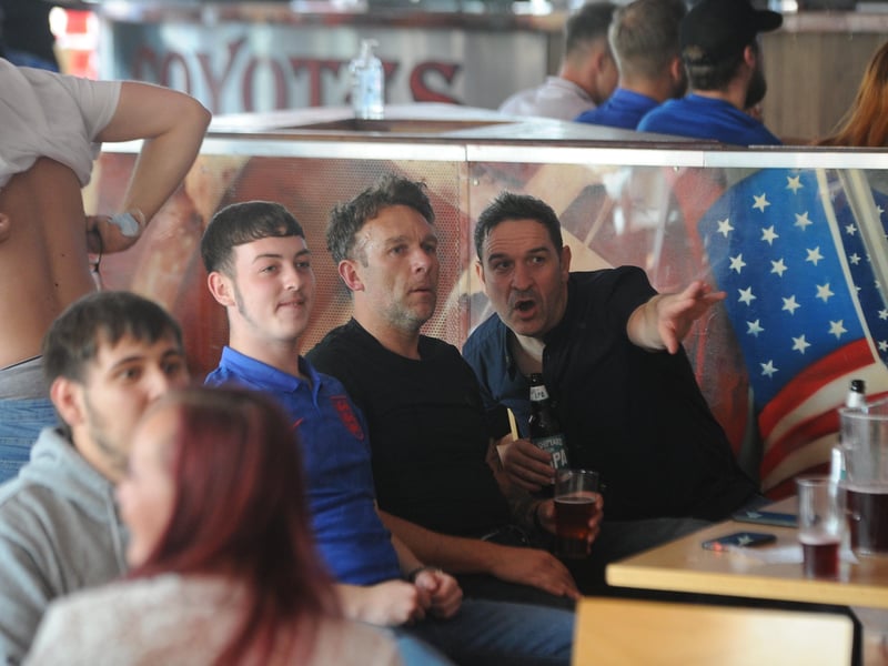 England fans at the Coyotes Bar, New Road, Peterborough EMN-210629-193253009