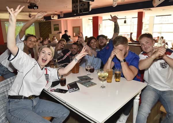 England fans at the Coyotes Bar, New Road, Peterborough EMN-210629-193348009