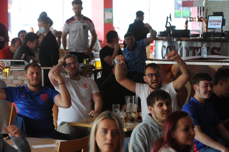 England fans at the Coyotes Bar, New Road, Peterborough EMN-210629-193326009