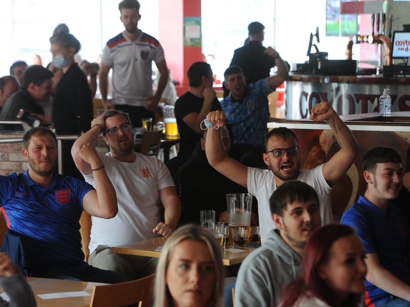 England fans at the Coyotes Bar, New Road, Peterborough EMN-210629-193326009