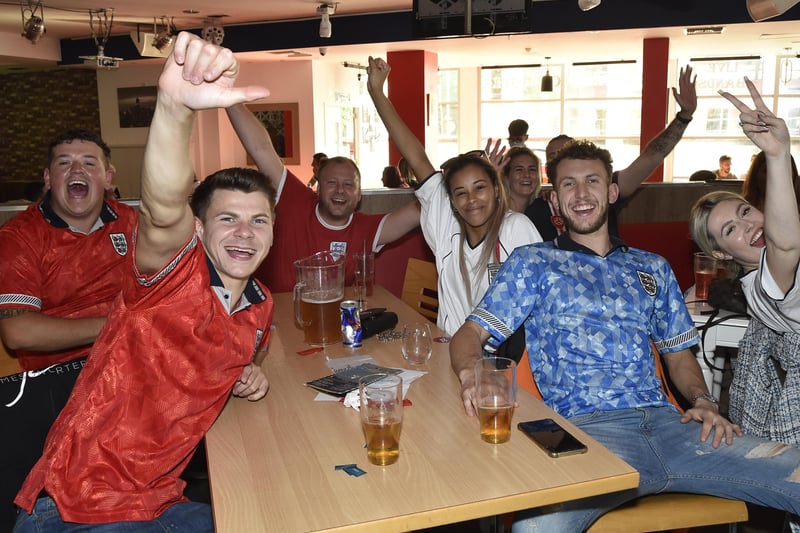England fans at the Coyotes Bar, New Road, Peterborough EMN-210629-193337009