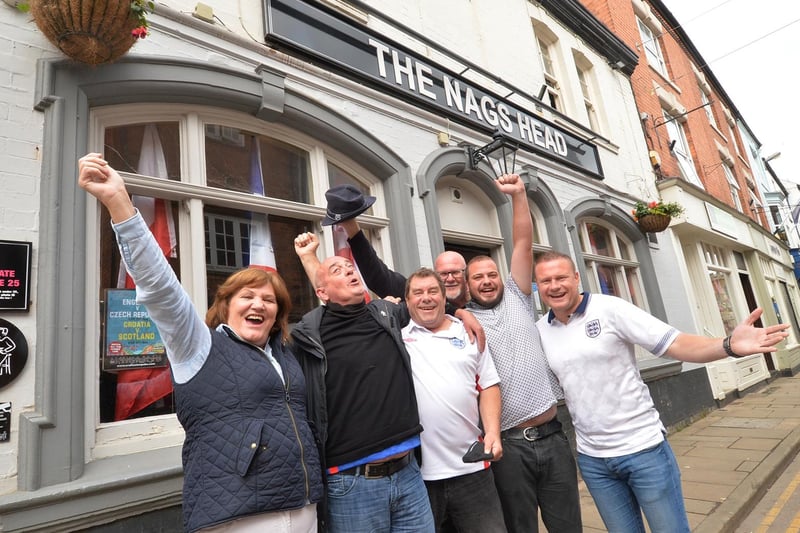 Celebrations outside the Nags Head in Market Harborough. We are loving that retro England top from the 1990 World Cup on the right!