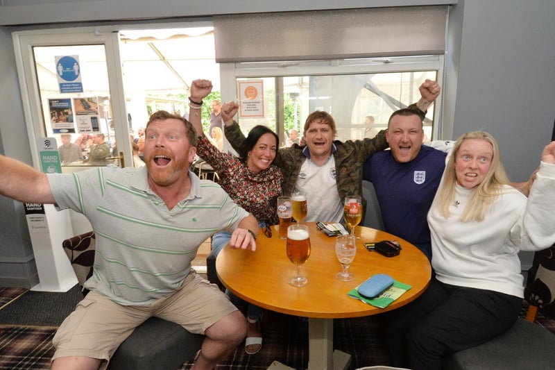 Fans celebrate England's first goal at the Royalist in Market Harborough.