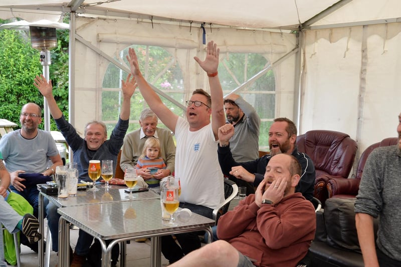 Fans celebrate England's second goal at the Royalist in Market Harborough.