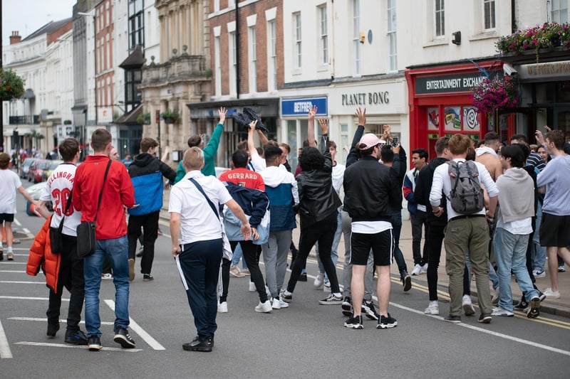Fans gather in the street to celebrate England's 2-0 win over Germany.