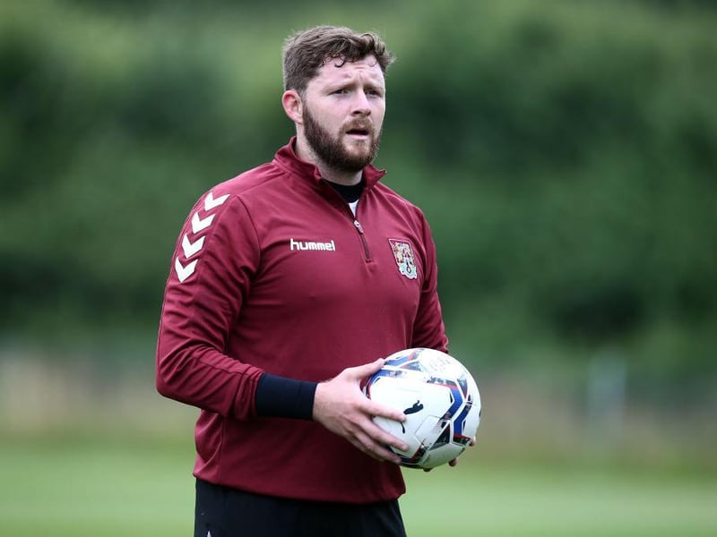 Exeter's number one from the play-off final will want the gloves for Town this season, but he faces a fight from the other senior goalkeeper.