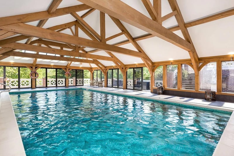 The property has an indoor pool with a fitted bar.