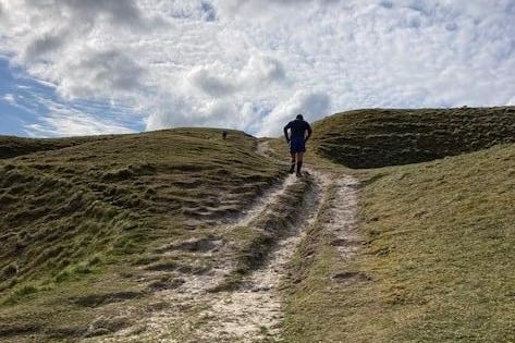 Climbing up the hill at the Long Man, Wilmington, by Karen Bailey. SUS-210707-121903001