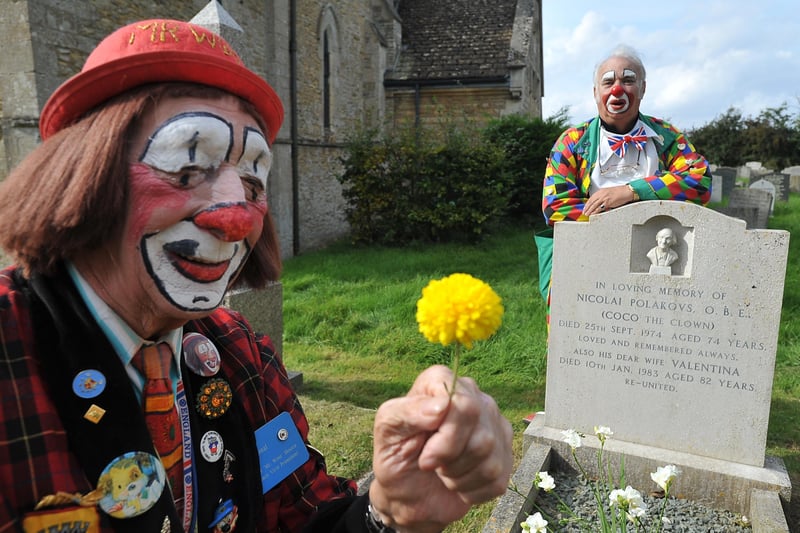 Mr Woo and Chuckles the Clown at the grave of Coco the Clown (Nicolai Poliakoff) at St Mary's Church, Woodnewton.