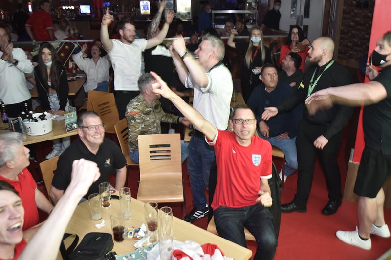 England fans watching the Euro 20 semi-final at the Coyotes Bar and Grill at New Road, Peterborough EMN-210707-230727009