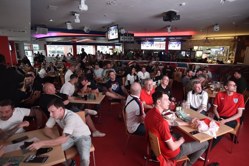England fans watching the Euro 20 semi-final at the Coyotes Bar and Grill at New Road, Peterborough EMN-210707-230950009