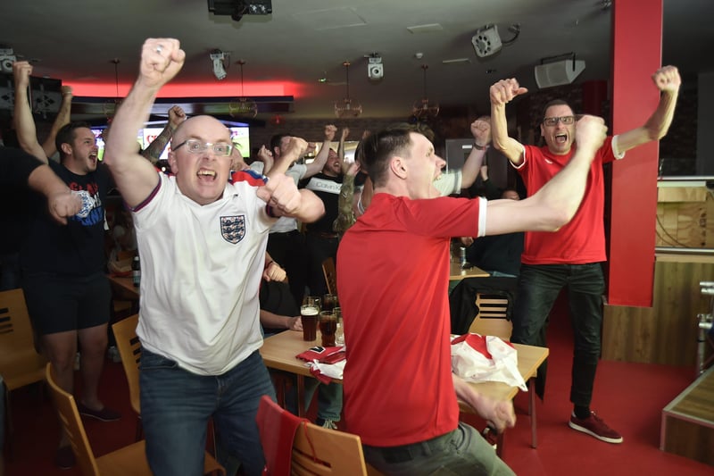 England fans watching the Euro 20 semi-final at the Coyotes Bar and Grill at New Road, Peterborough EMN-210707-231001009