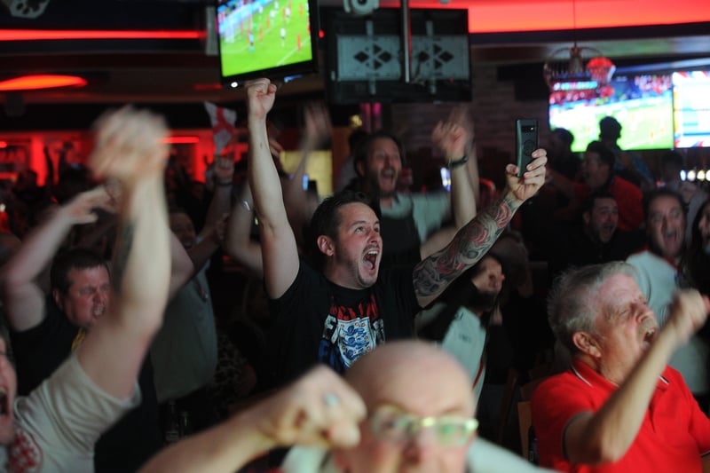 England fans watching the Euro 20 semi-final at the Coyotes Bar and Grill at New Road, Peterborough EMN-210707-231213009