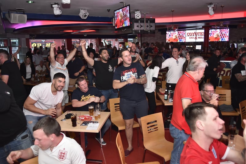 England fans watching the Euro 20 semi-final at the Coyotes Bar and Grill at New Road, Peterborough EMN-210707-231023009