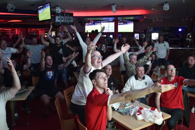 England fans watching the Euro 20 semi-final at the Coyotes Bar and Grill at New Road, Peterborough EMN-210707-231034009