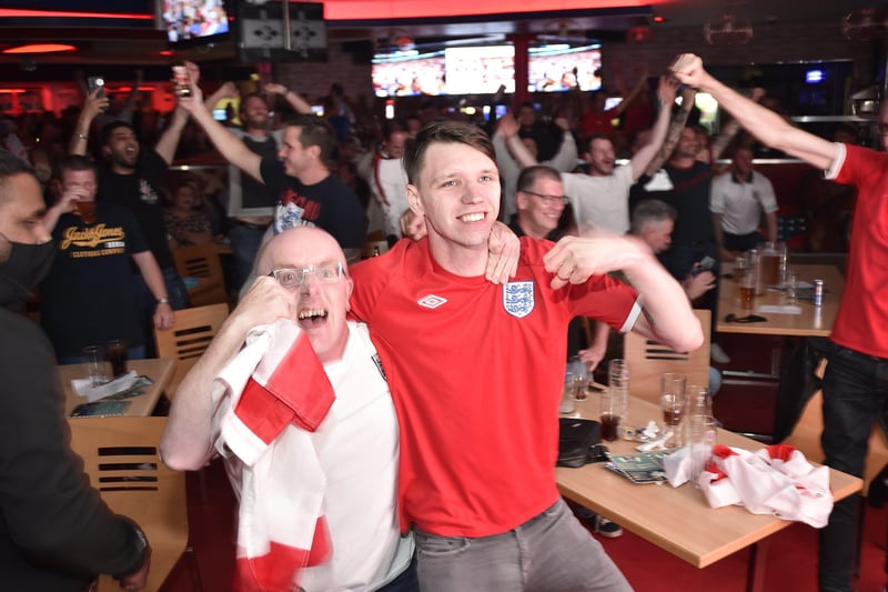 England fans watching the Euro 20 semi-final at the Coyotes Bar and Grill at New Road, Peterborough EMN-210707-231056009