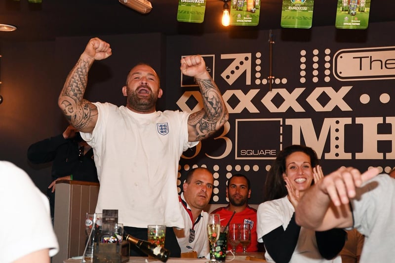 Joy as England fans celebrate drawing level with Denmark at Bar Fifty Three on The Square.