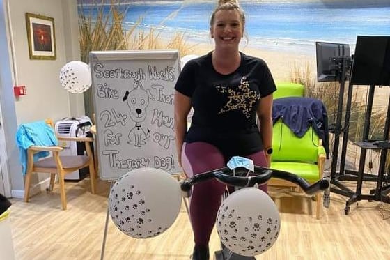 Emma Camm peddling for the therapy dog appeal.