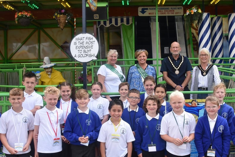 Mayor and Mayoress of Skegness, Coun Trevor and Jane Burnham (back row, right), with Sally Hobbins and Anne Roberjot of the Skegness area branch of the NSPCC, pictured with children at the Skegness Vintage Fair.