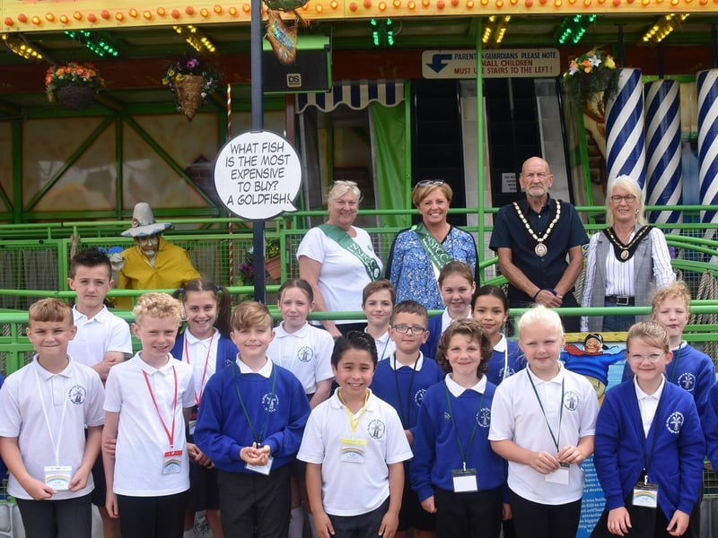 Mayor and Mayoress of Skegness, Coun Trevor and Jane Burnham (back row, right), with Sally Hobbins and Anne Roberjot of the Skegness area branch of the NSPCC, pictured with children at the Skegness Vintage Fair.