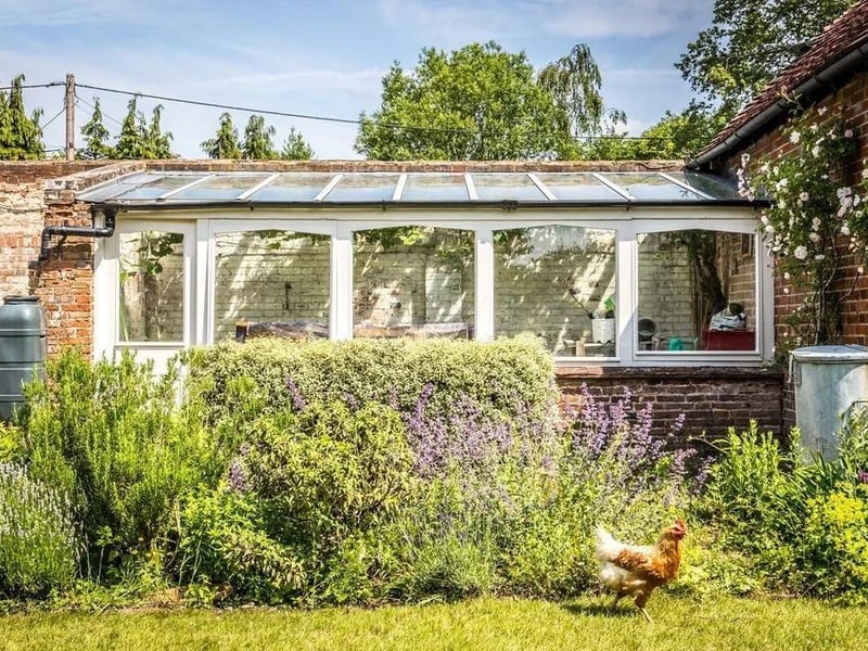 There is a Victorian conservatory to the east of the part-walled garden.