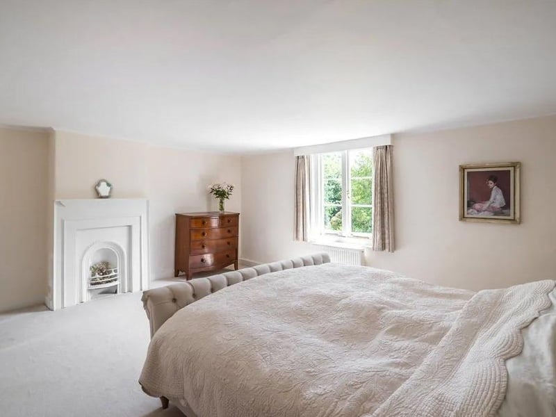 The master bedroom suite has a large dressing room and en suite bathroom.