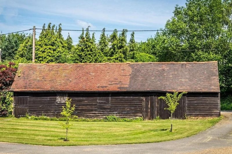 Opposite the garage is a large timber outbuilding, which was formerly a stable.