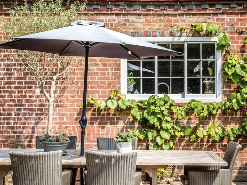 Adjoining the south of the house is a brick patio.