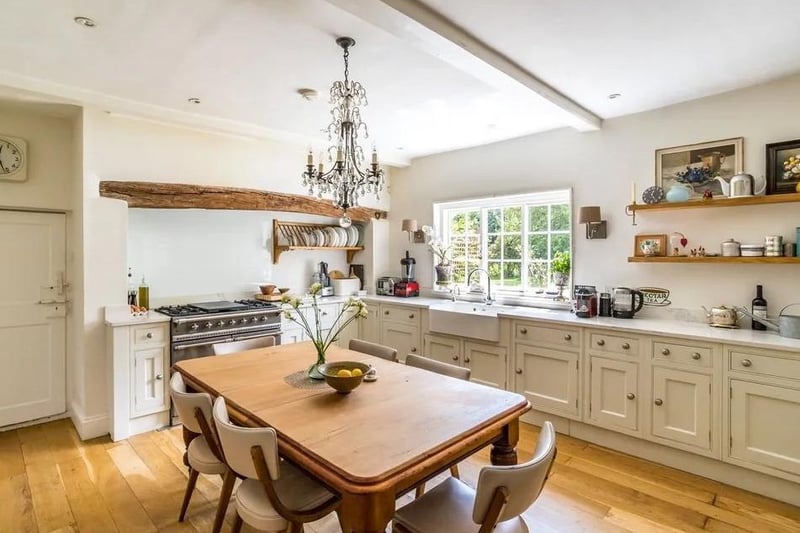 The modern kitchen is at the heart of the house and offers views over the rear gardens.