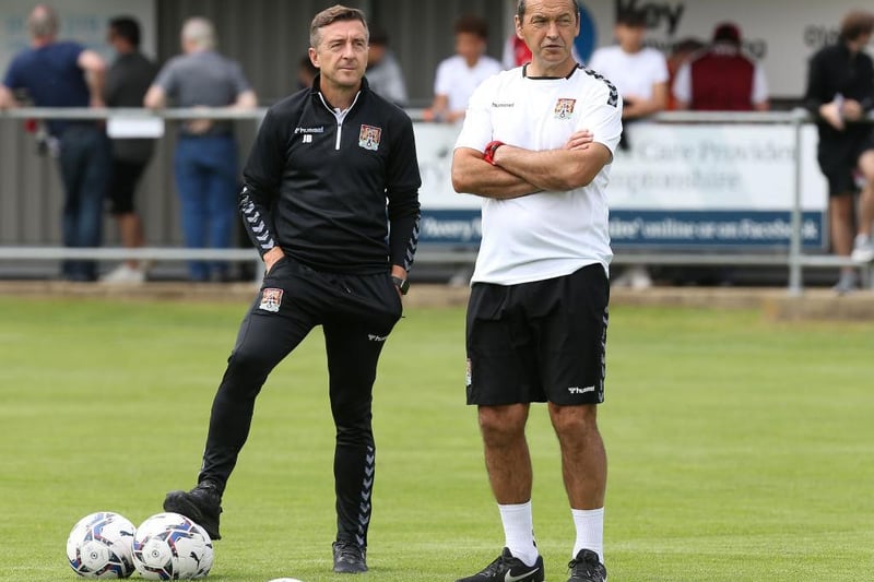 Jon Brady and new assistant Colin Calderwood watch over their players. Calderwood had been working his notice period at Blackpool up until the last few days.
