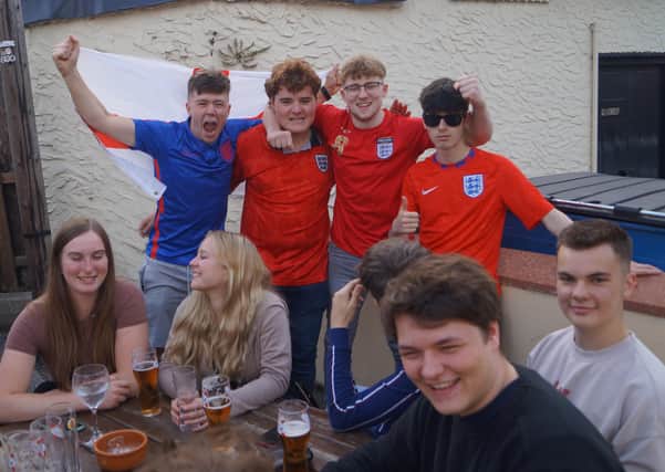 Smiles and cheers ahead of the Euro2020 final in Rasen's pubs EMN-211207-071351001