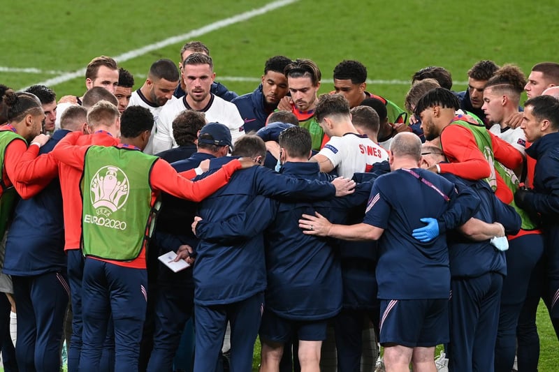 Southgate talks to his players before extra time