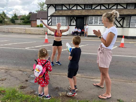 Ethan and Sienna Rawlings cooling the runners down in Radford Semele during the Leamington Half Marathon yesterday. Photo by Si Rawlings.