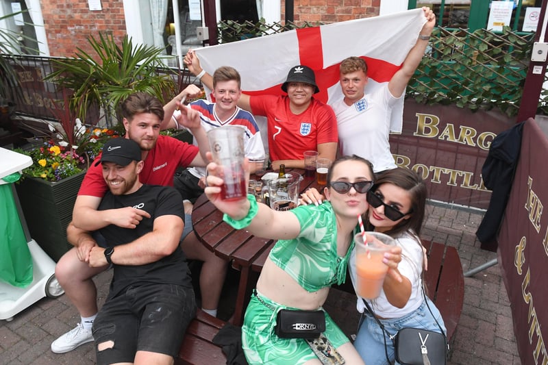 England fans in positive mood at the Barge and Bottle, Sleaford. EMN-211207-092251001