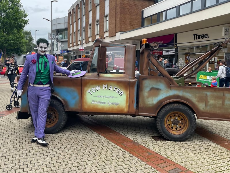 The Joker next to the tow mater car from the film ‘Cars