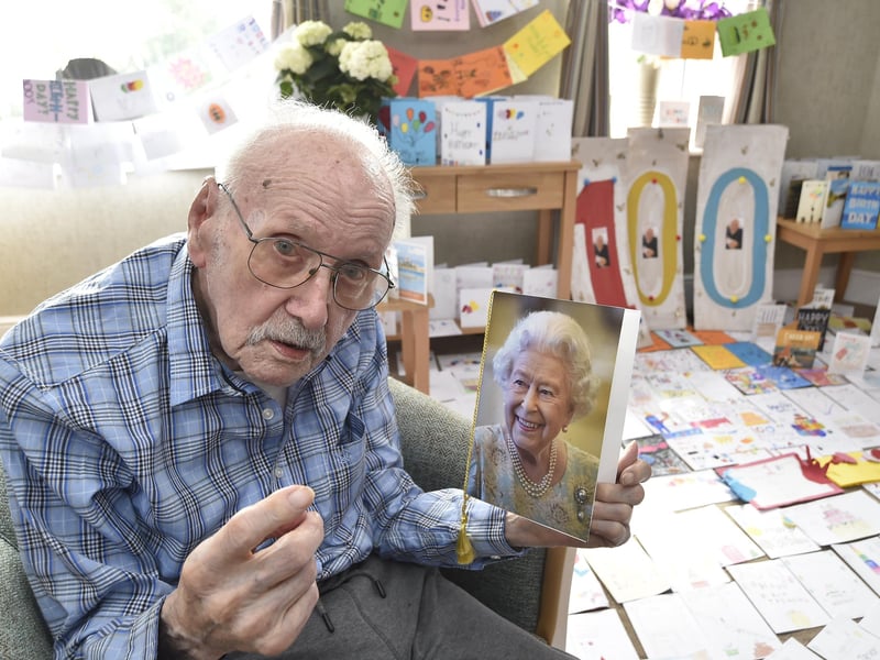 Trevor with his card from the queen.