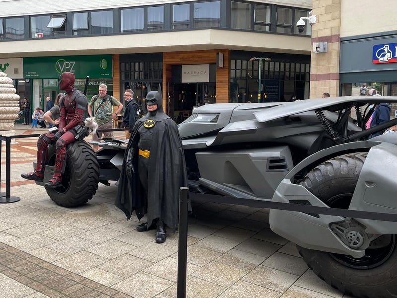 Deadpool takes a seat on Batman's Batmobile