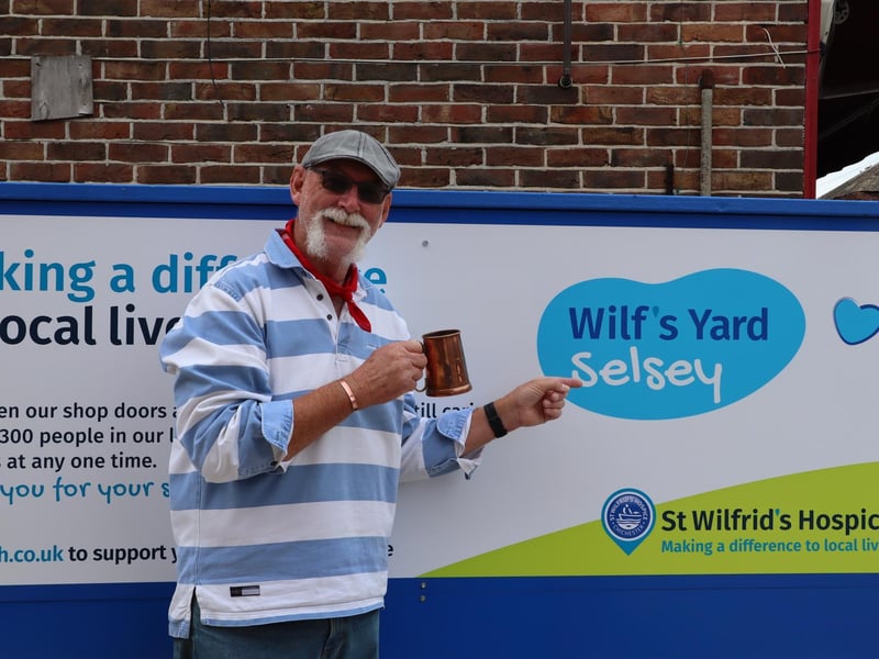Mick of the Selsey Shantymen bags the first bargain of the day