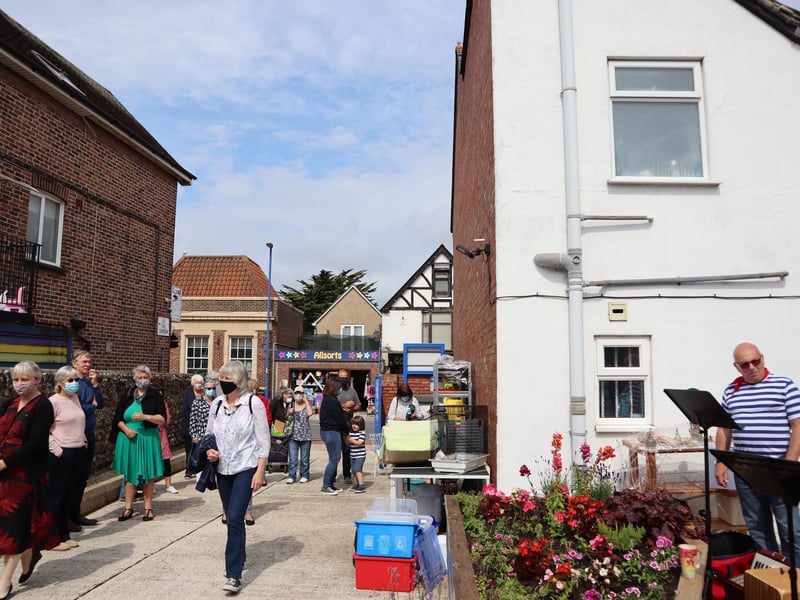 The Selsey Shantymen welcomed dozens of shoppers after the ribbon cutting