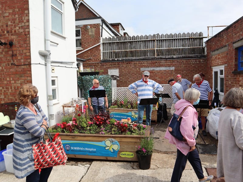 The Selsey Shantymen welcomed dozens of shoppers after the ribbon cutting