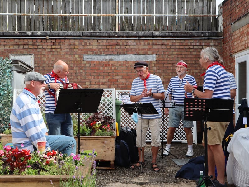 The Selsey Shantymen welcomed dozens of shoppers after the ribbon cutting