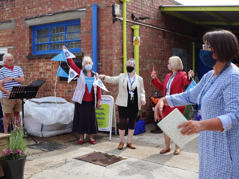 New shop manager Michelle and Fiona cut the ribbon