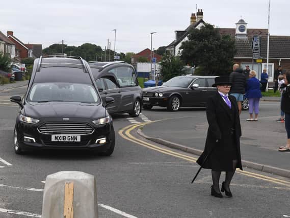 Funeral director Sarah Northdurft, of Frank Wood Funeralcare, leads the cortege.